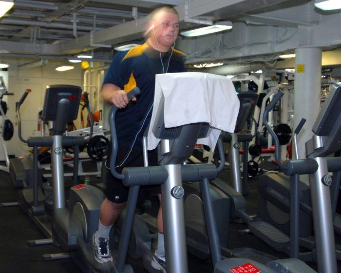 Male on Elliptical Training machine