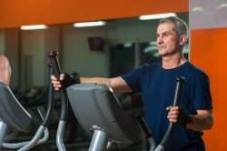 Male Senior using Elliptical Machine